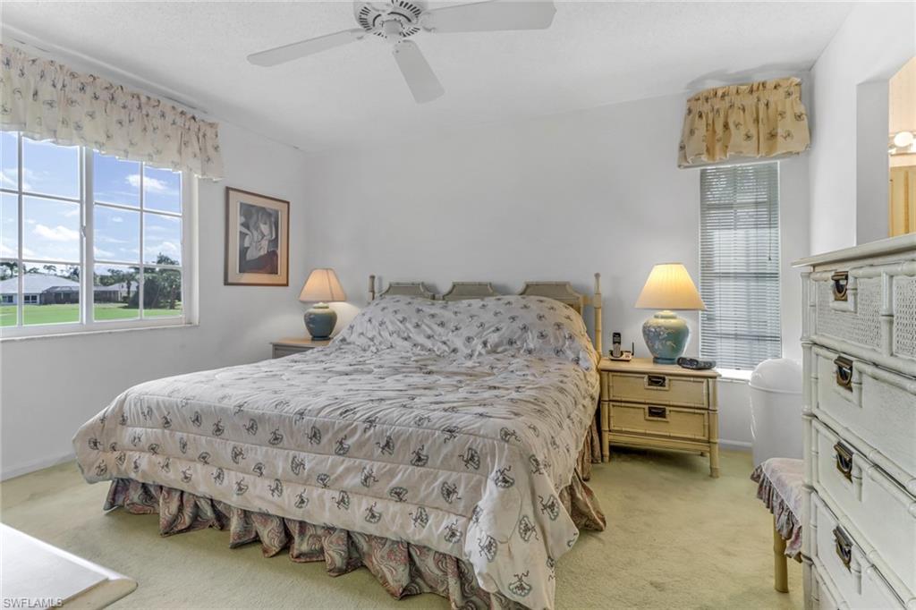 780 Augusta Boulevard, Unit C204 Naples, FL 34113 - Photo 18 of 40 a bedroom with a bed and a window