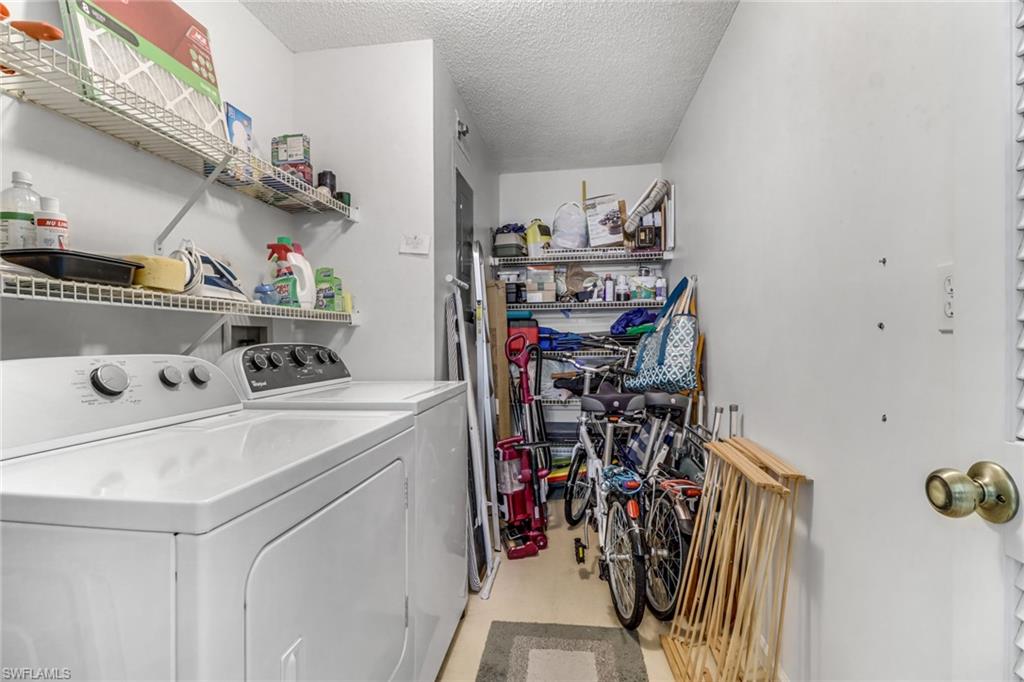 780 Augusta Boulevard, Unit C204 Naples, FL 34113 - Photo 27 of 40 a storage room with washer and dryer
