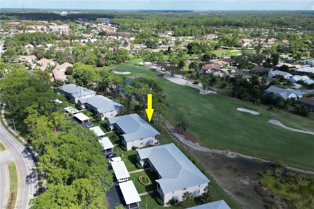 780 Augusta Boulevard, Unit C204 Naples, FL 34113 - Photo 28 of 40 an aerial view of multiple house