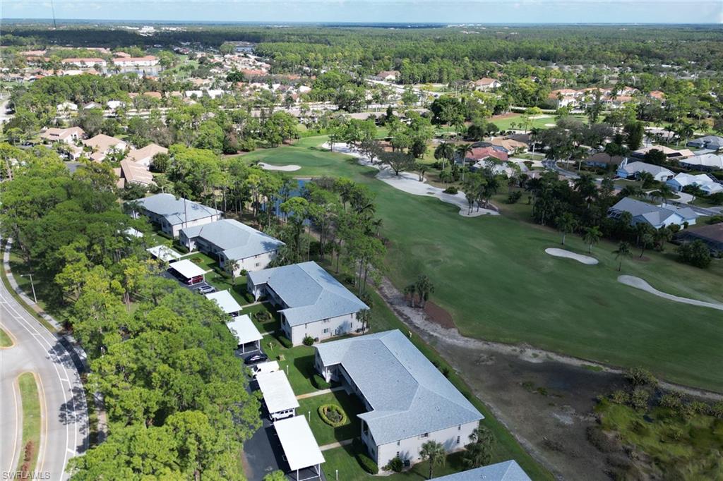 780 Augusta Boulevard, Unit C204 Naples, FL 34113 - Photo 32 of 40 an aerial view of multiple house