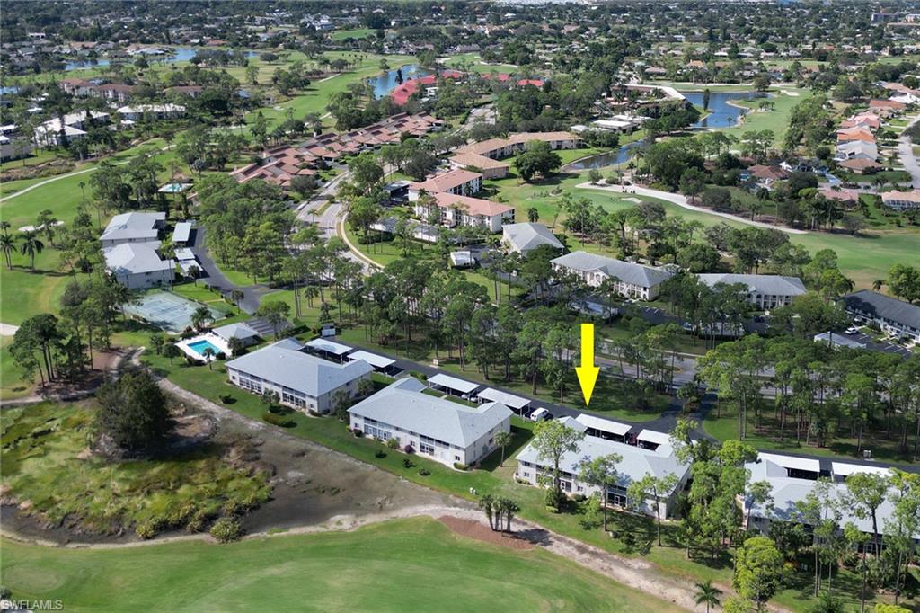 780 Augusta Boulevard, Unit C204 Naples, FL 34113 - Photo 34 of 40 an aerial view of residential houses with city view