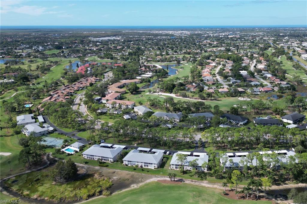 780 Augusta Boulevard, Unit C204 Naples, FL 34113 - Photo 35 of 40 an aerial view of residential houses with city view