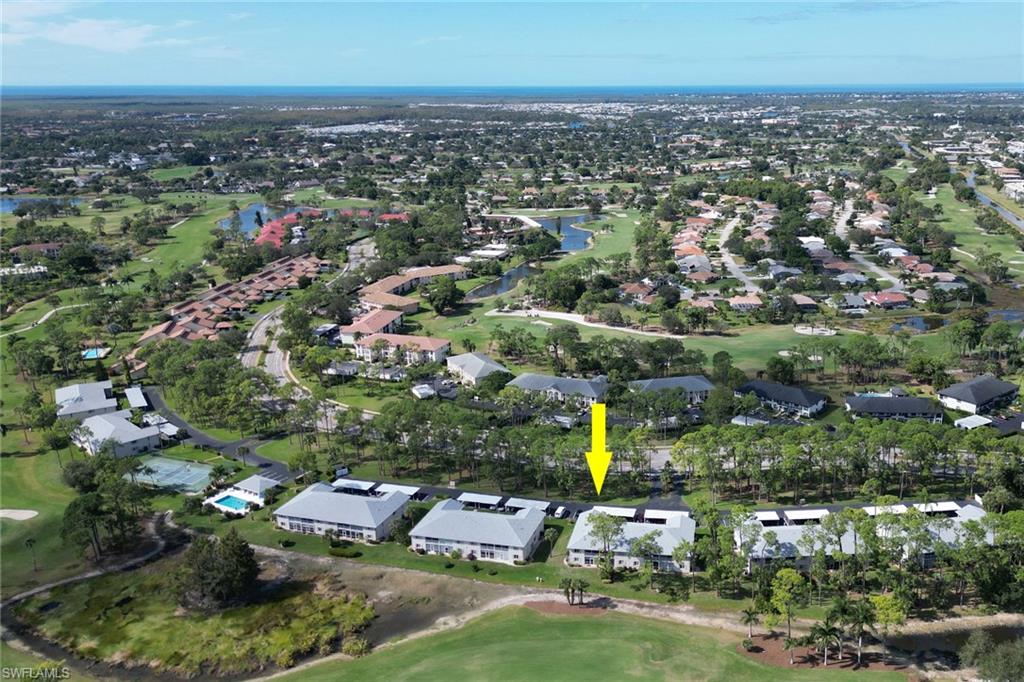 780 Augusta Boulevard, Unit C204 Naples, FL 34113 - Photo 36 of 40 an aerial view of residential houses with city view