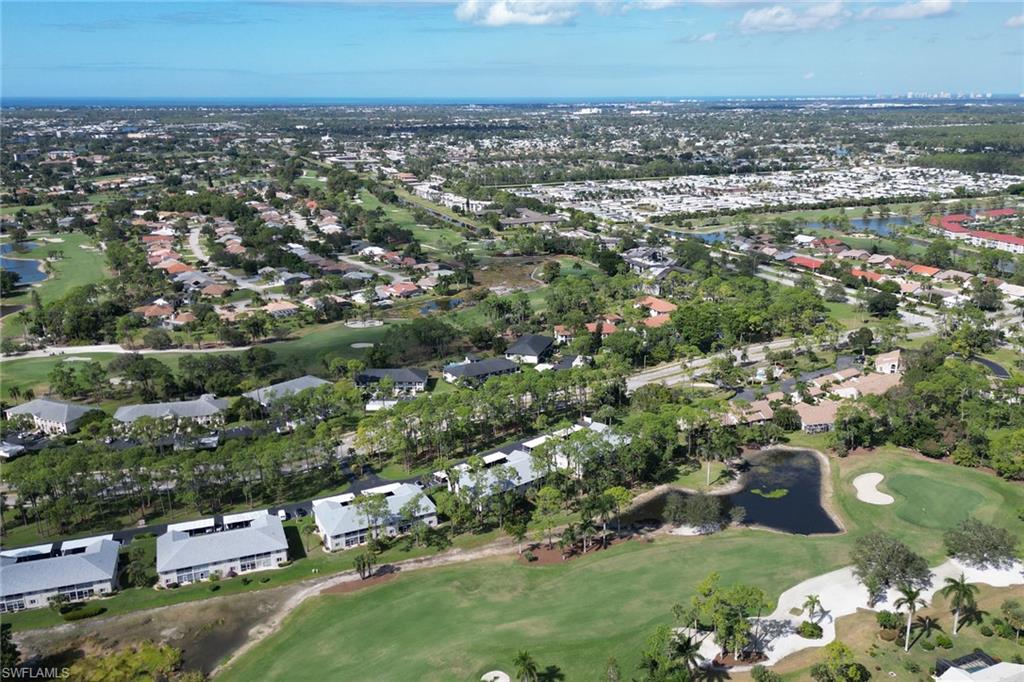 780 Augusta Boulevard, Unit C204 Naples, FL 34113 - Photo 37 of 40 an aerial view of multiple house