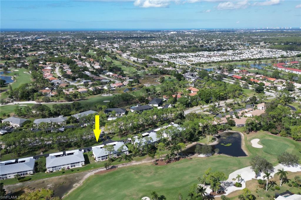 780 Augusta Boulevard, Unit C204 Naples, FL 34113 - Photo 38 of 40 an aerial view of multiple house