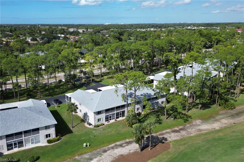 780 Augusta Boulevard, Unit C204 Naples, FL 34113 - Photo 39 of 40 an aerial view of multiple house