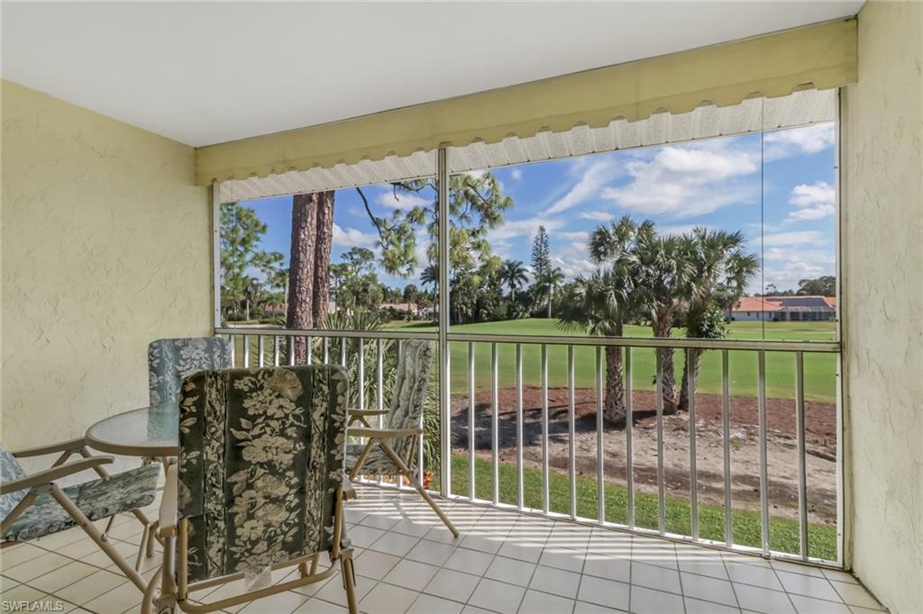 780 Augusta Boulevard, Unit C204 Naples, FL 34113 - Photo 5 of 40 a view of a balcony with lake view and mountain view