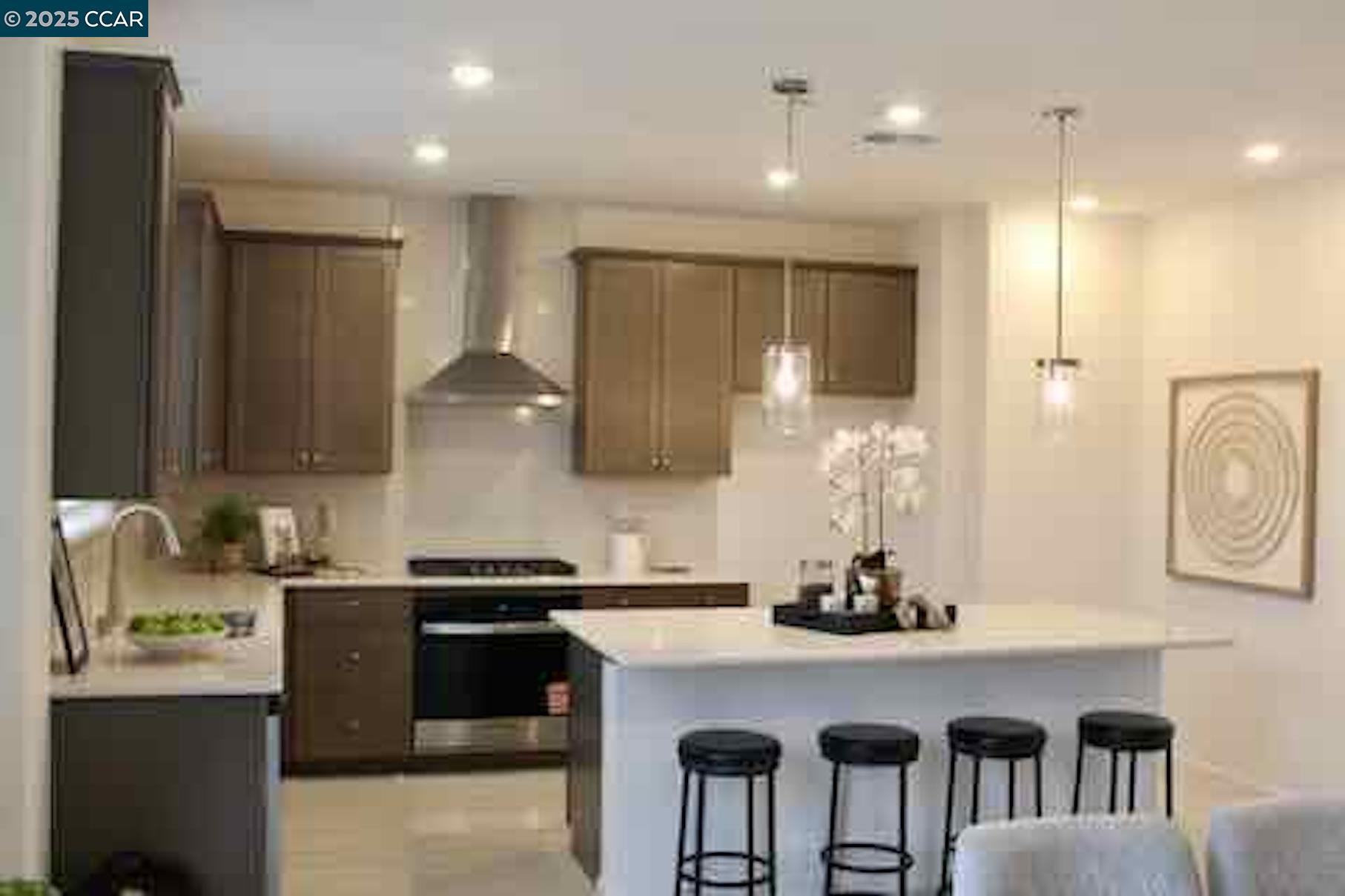 822 Engineer Circle Vacaville, CA 95687 - Photo 5 of 6 a kitchen with kitchen island granite countertop a sink a counter space and stainless steel appliances