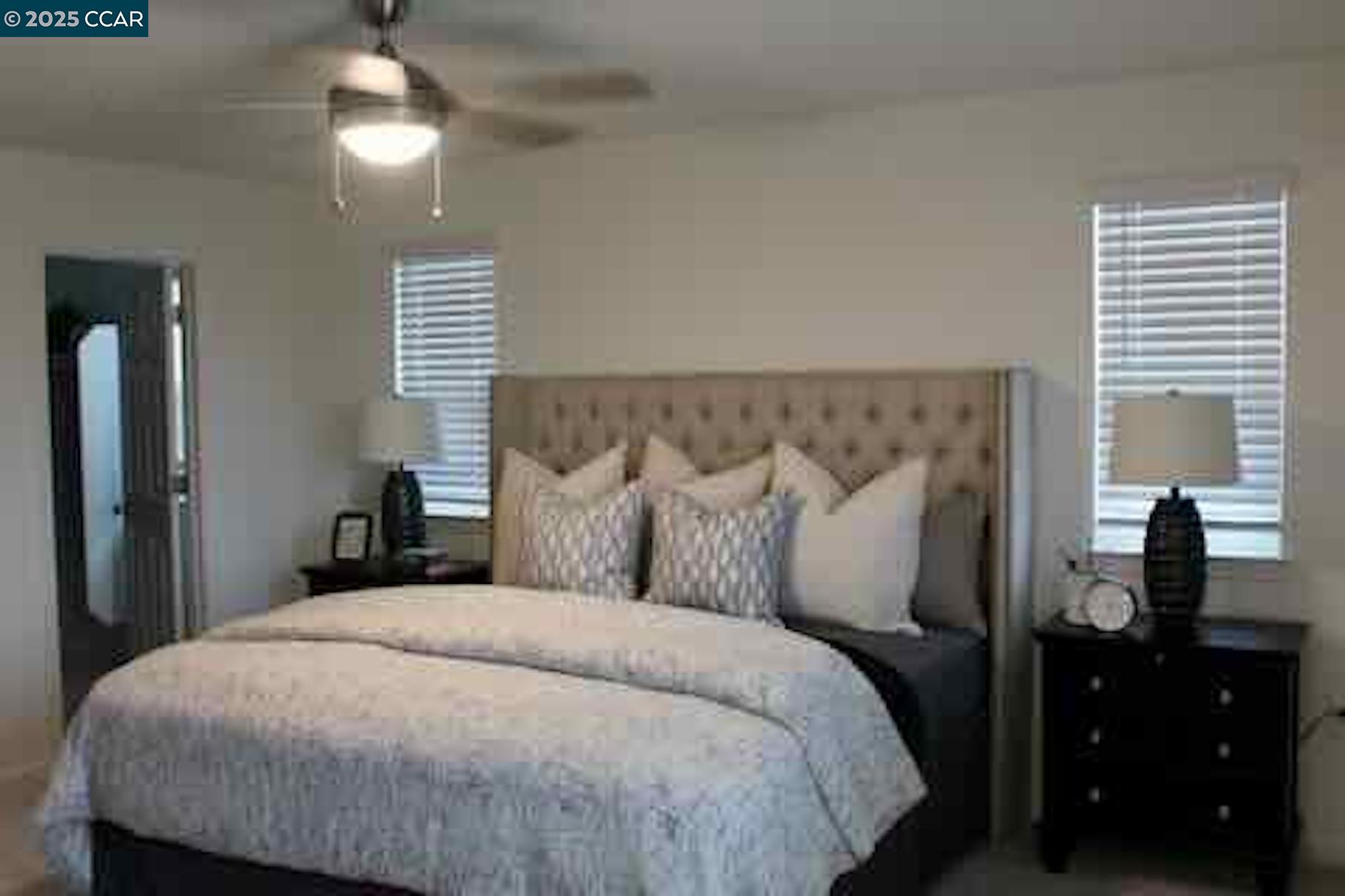822 Engineer Circle Vacaville, CA 95687 - Photo 6 of 6 a bedroom with a bed and a lamp on dresser