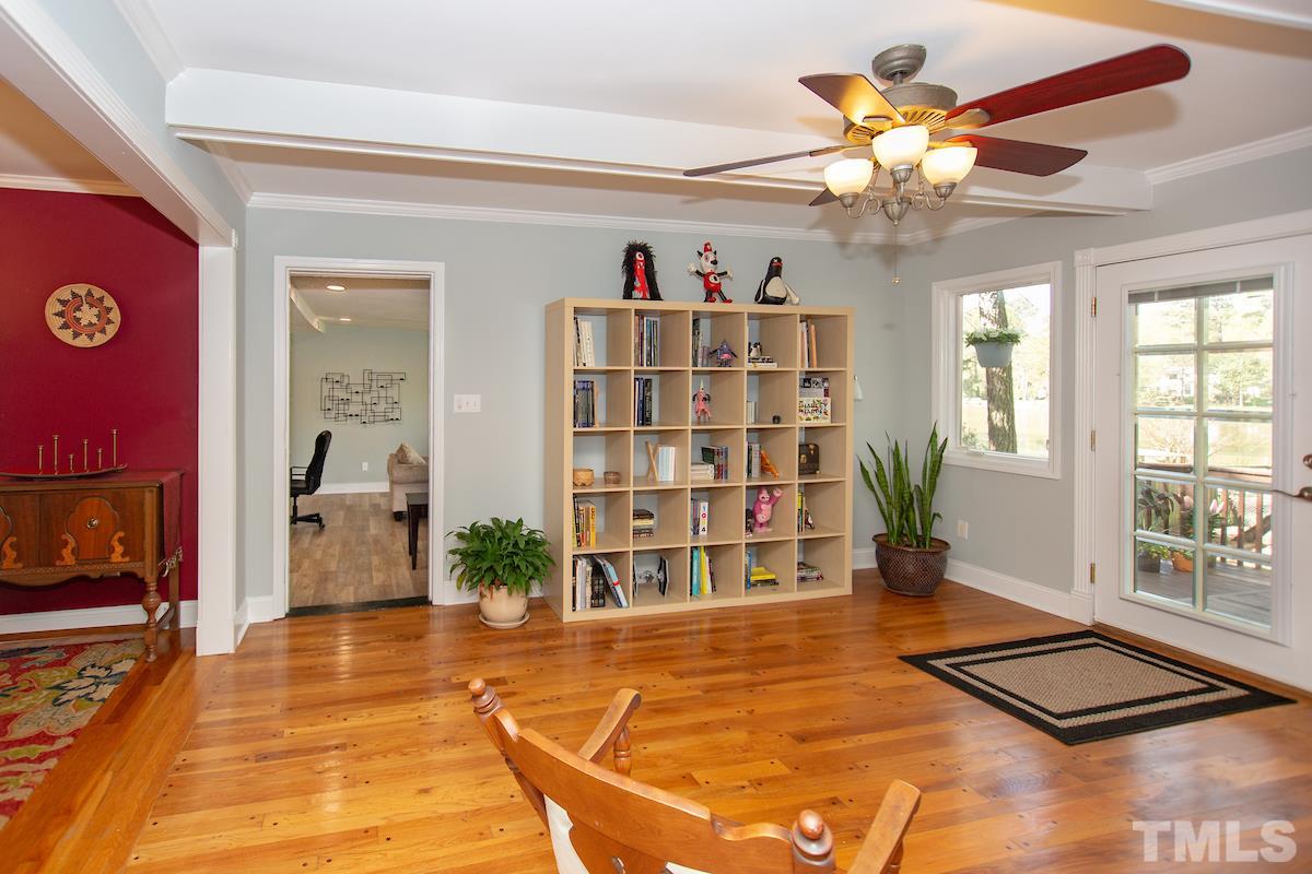 5300 Newhall Road Durham, NC 27713 - Photo 14 of 30 a view of an empty room with a window and chandelier