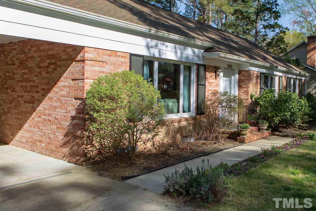 5300 Newhall Road Durham, NC 27713 - Photo 3 of 30 a view of a house with potted plants
