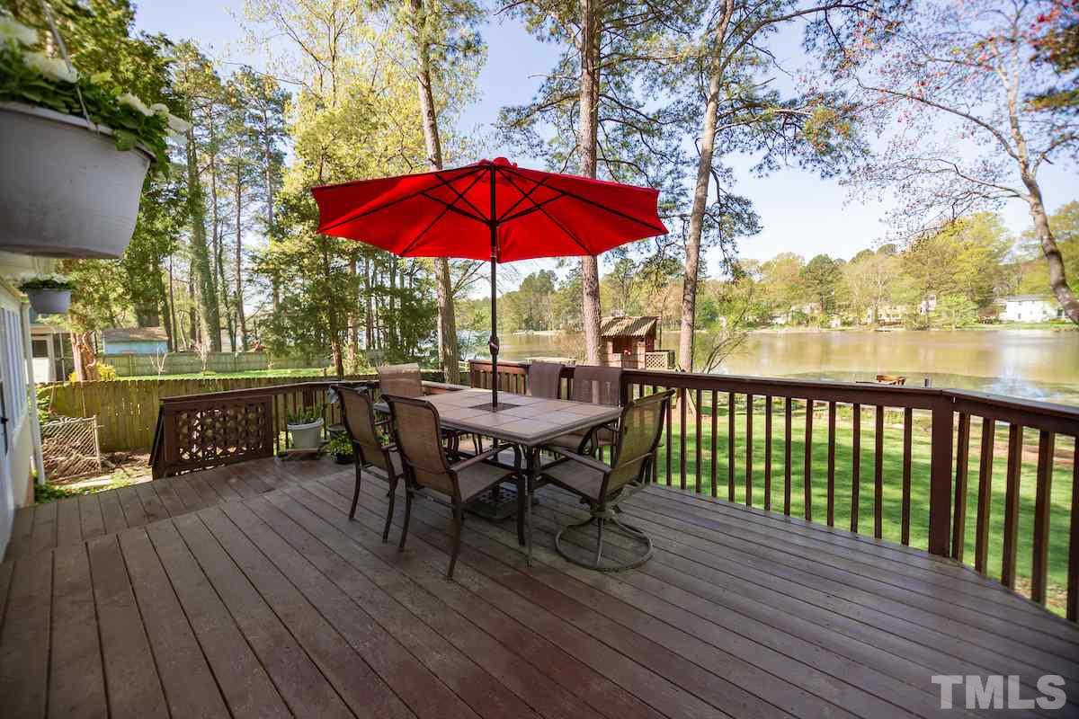 5300 Newhall Road Durham, NC 27713 - Photo 22 of 30 a view of balcony with outdoor seating and wooden floor