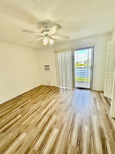 147 Fanshaw D Boca Raton, FL 33434 - Photo 5 of 27 wooden floor in an empty room