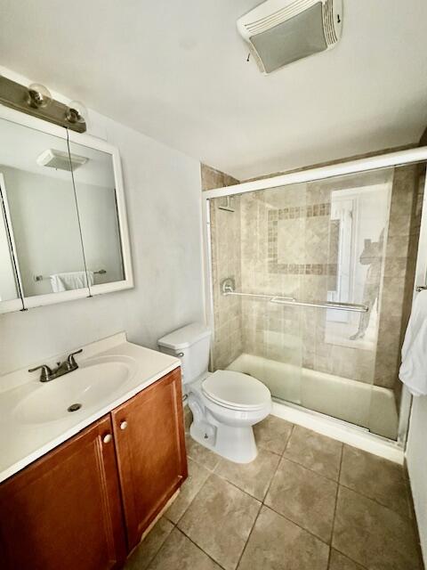 147 Fanshaw D Boca Raton, FL 33434 - Photo 6 of 27 a bathroom with a sink toilet and shower