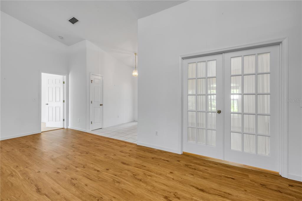 192 Azalea Road Edgewater, FL 32141 - Photo 46 of 94 a view of an empty room with wooden floor