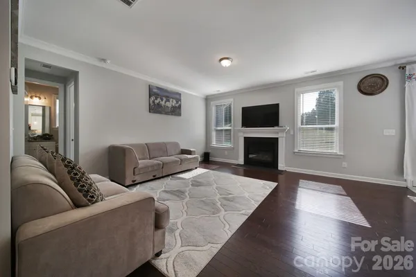 a living room with furniture flat screen tv and a fireplace