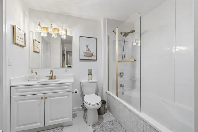 a bathroom with a toilet sink shower and a bathtub