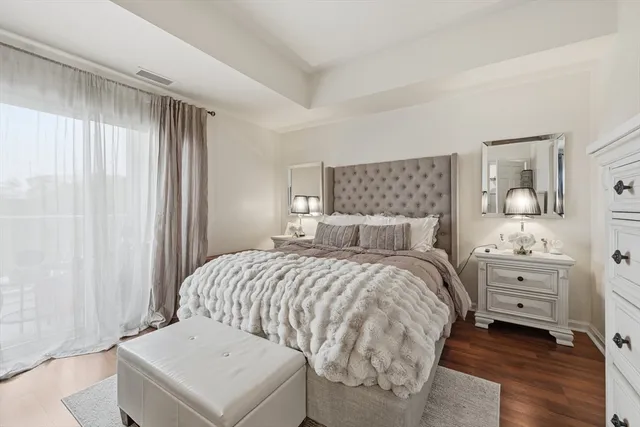 a bedroom with a bed and a dresser