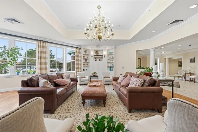 a living room with furniture or couch and a large window