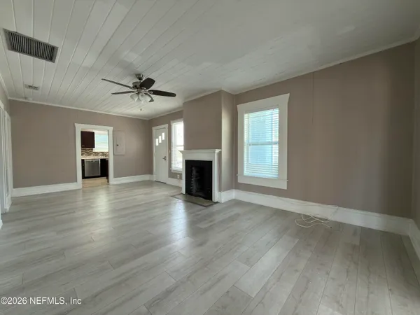 a kitchen with stainless steel appliances granite countertop a sink stove and microwave