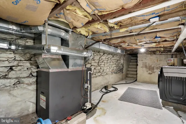 a view of a backyard with wooden fence