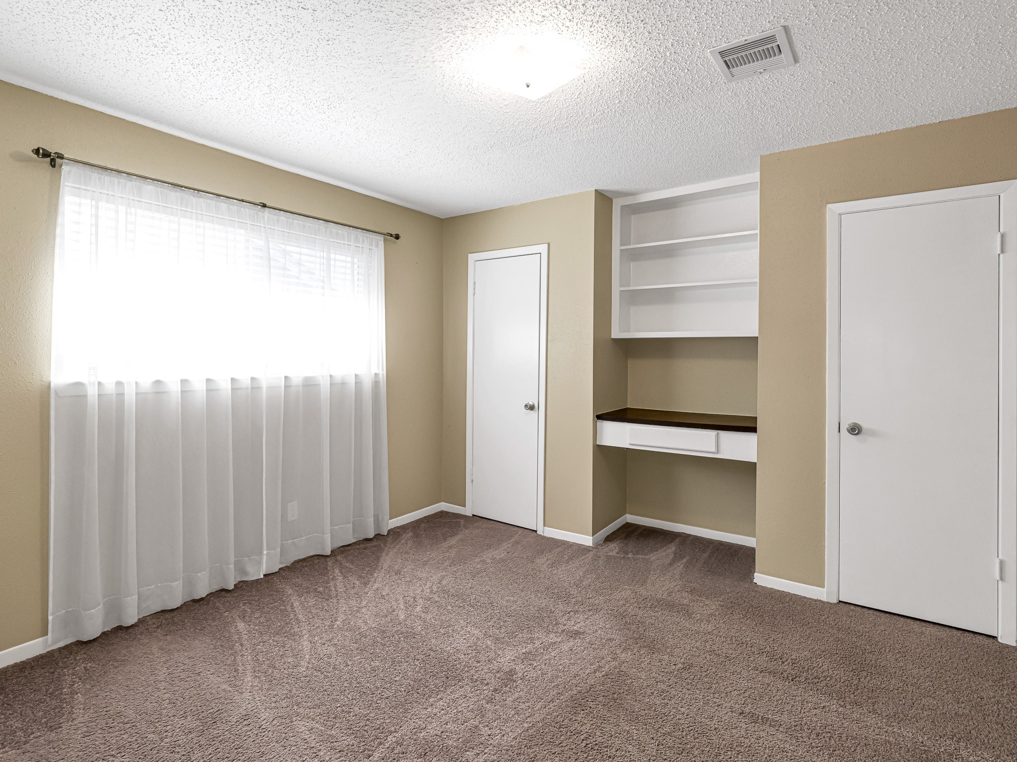 6230 Sunnygate Drive Spring, TX 77373 - Photo 25 of 33 Secondary bedroom features dual closets and built-in desk.