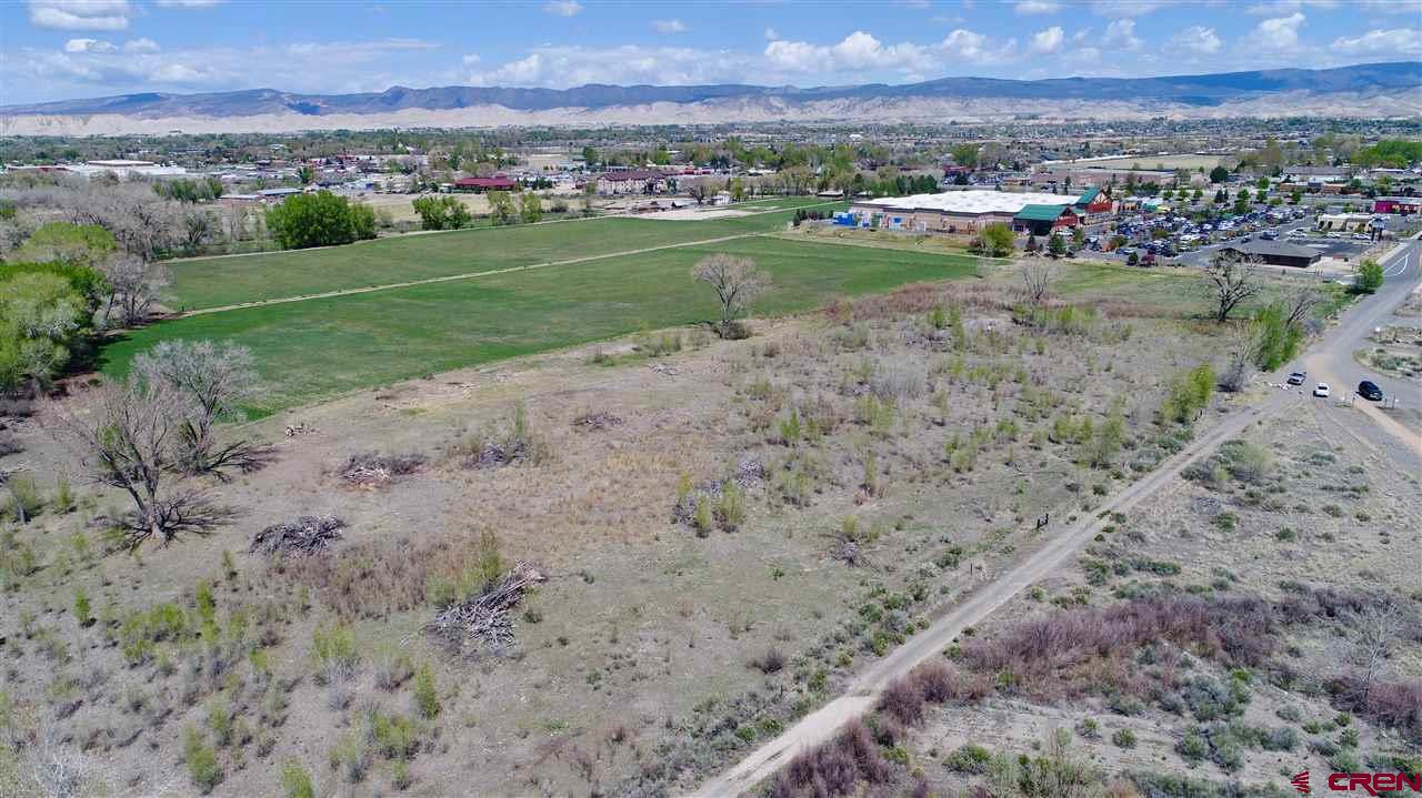 Tbd Tbd Montrose, CO 81401 - Photo 11 of 15 a view of a lake with a city