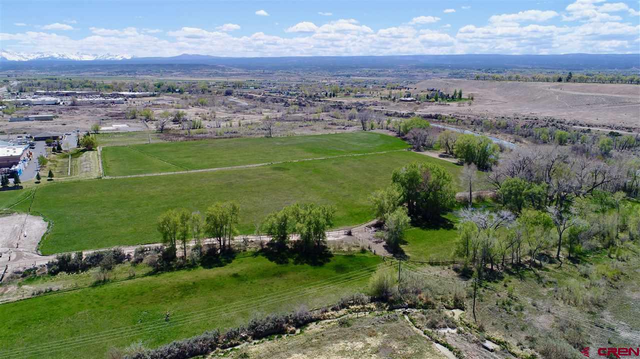 Tbd Tbd Montrose, CO 81401 - Photo 6 of 15 an aerial view of a residential houses with outdoor space and trees