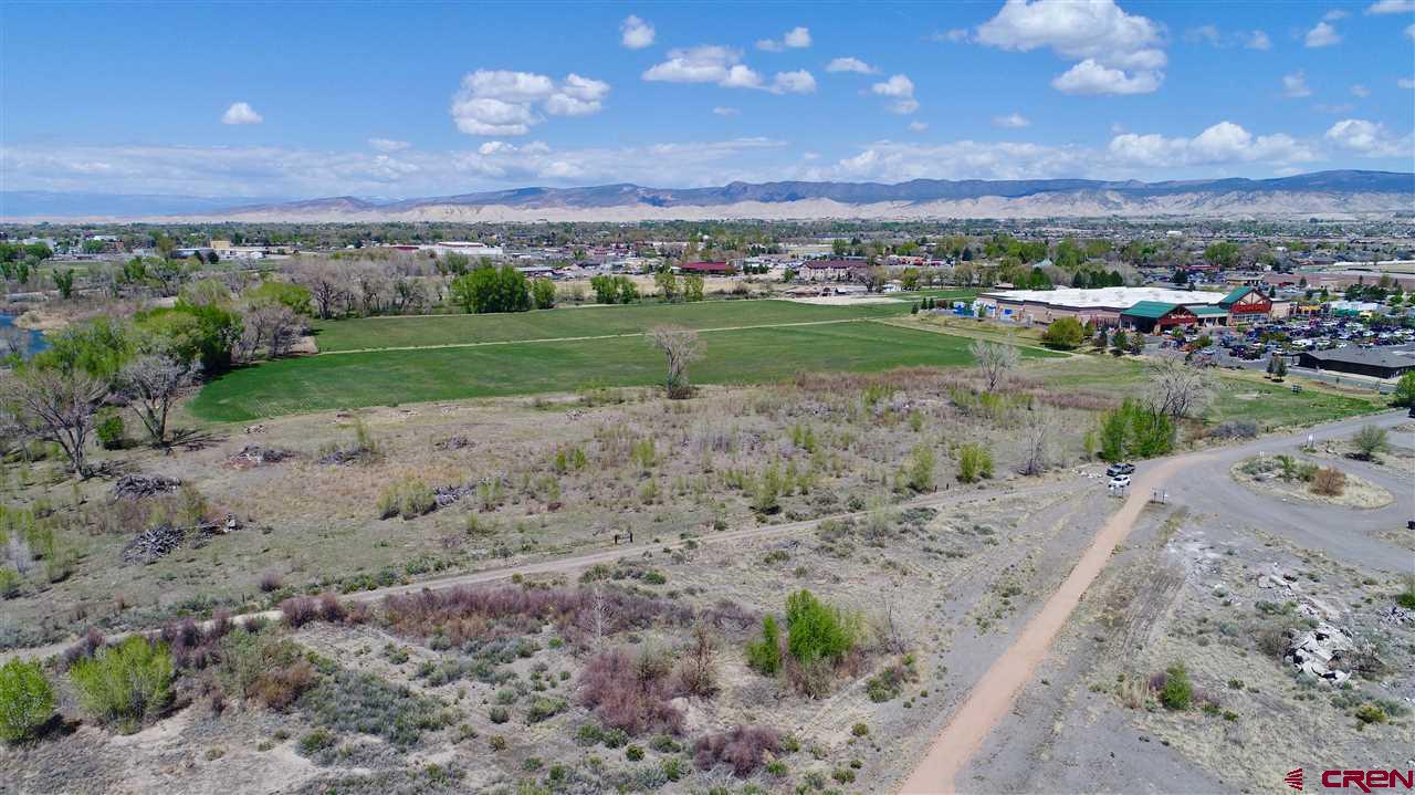 Tbd Tbd Montrose, CO 81401 - Photo 10 of 15 a view of a big yard with a lake view