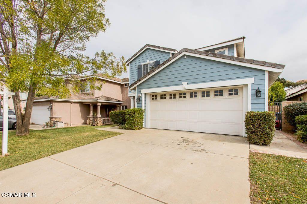 1752 Empty Saddle Road Simi Valley, CA 93063 - Photo 2 of 34 a front view of a house with a yard and garage