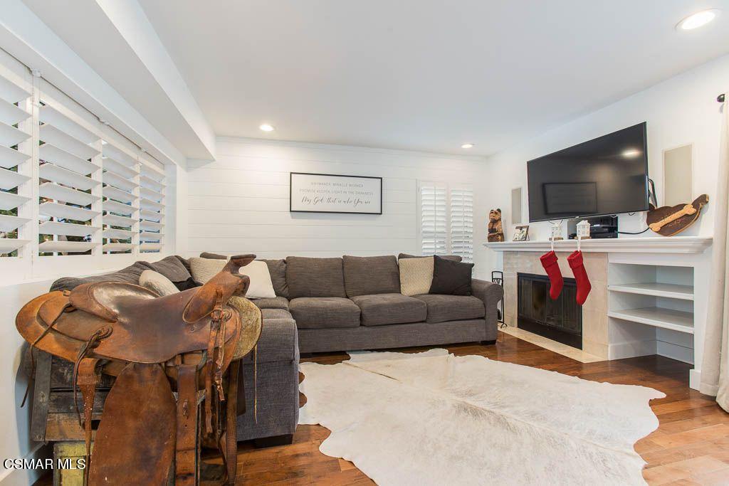 1752 Empty Saddle Road Simi Valley, CA 93063 - Photo 11 of 34 a living room with furniture and a flat screen tv