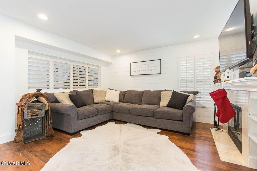 1752 Empty Saddle Road Simi Valley, CA 93063 - Photo 12 of 34 a living room with furniture or couch and a flat screen tv