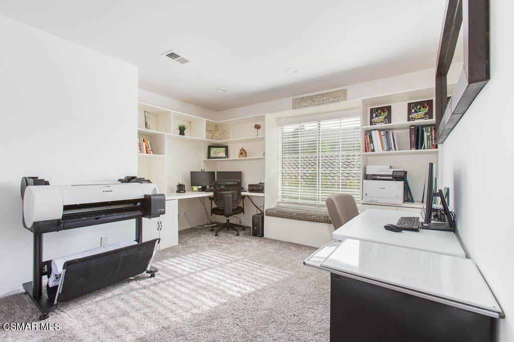1752 Empty Saddle Road Simi Valley, CA 93063 - Photo 25 of 34 a living room with furniture and a table