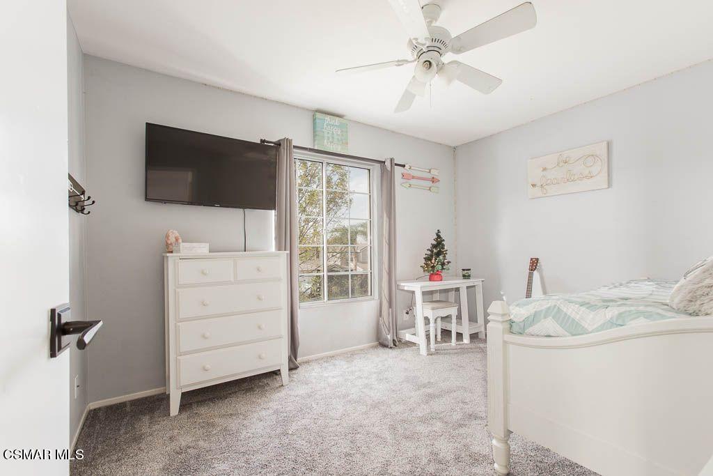 1752 Empty Saddle Road Simi Valley, CA 93063 - Photo 26 of 34 a living room with furniture and a flat screen tv