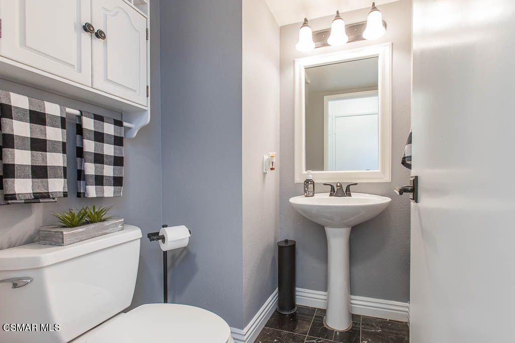 1752 Empty Saddle Road Simi Valley, CA 93063 - Photo 29 of 34 a bathroom with a sink toilet and mirror