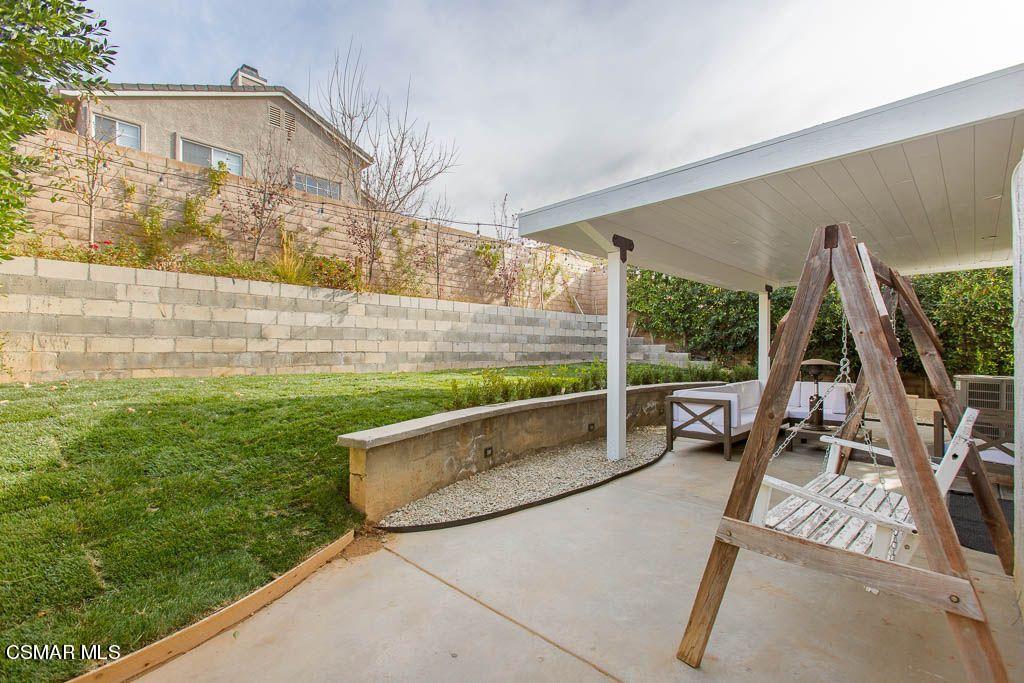 1752 Empty Saddle Road Simi Valley, CA 93063 - Photo 31 of 34 a view of a patio with a table and chairs