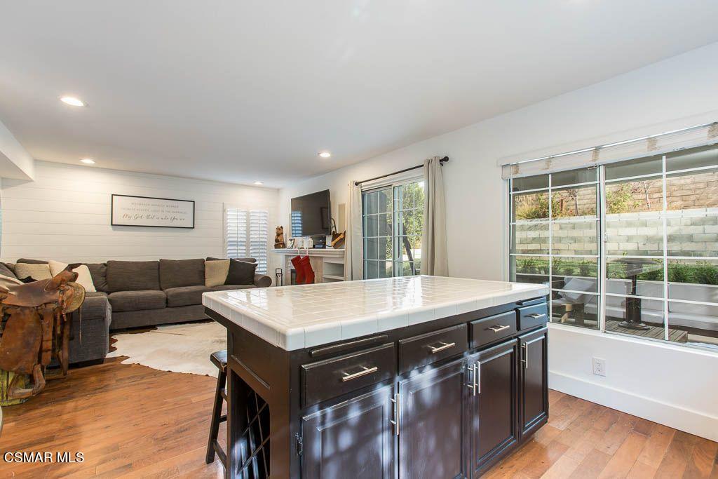 1752 Empty Saddle Road Simi Valley, CA 93063 - Photo 8 of 34 a view of a living room kitchen and a wooden floor