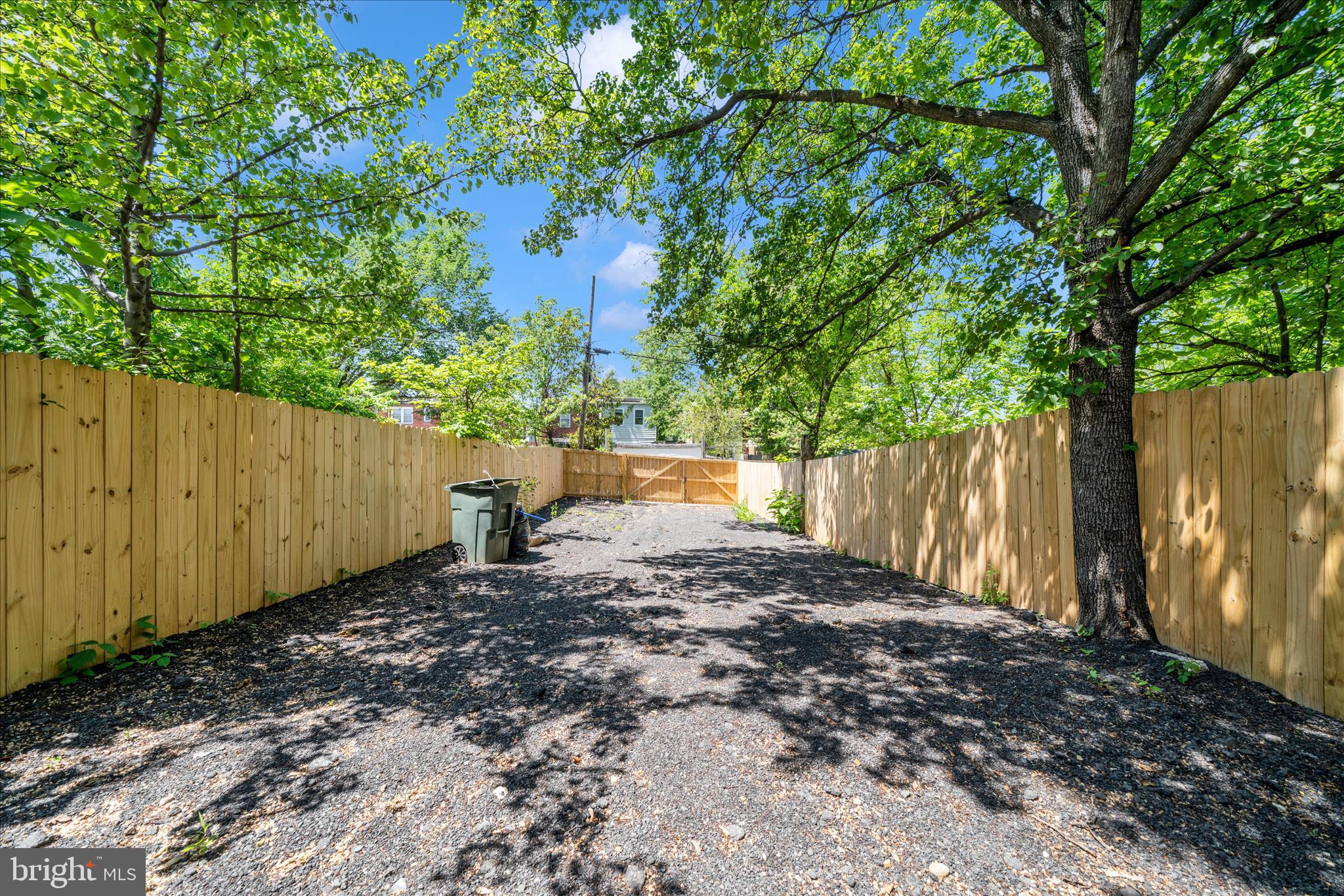 5027 Benning Road Southeast Washington, DC 20019 - Photo 55 of 57 a view of a backyard with tree