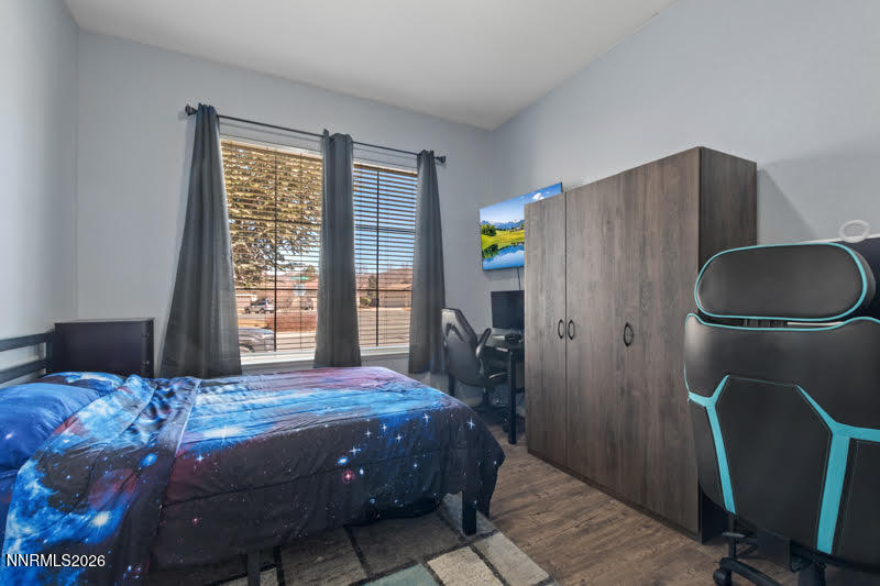 10025 Hampton Park Drive Reno, NV 89521 - Photo 6 of 16 a bedroom with a bed dresser and a window
