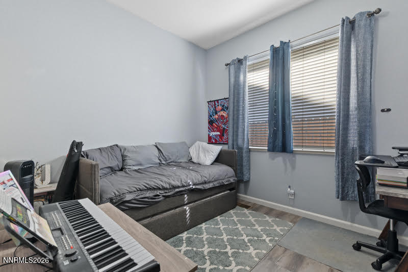 10025 Hampton Park Drive Reno, NV 89521 - Photo 8 of 16 a bedroom with a bed and a window