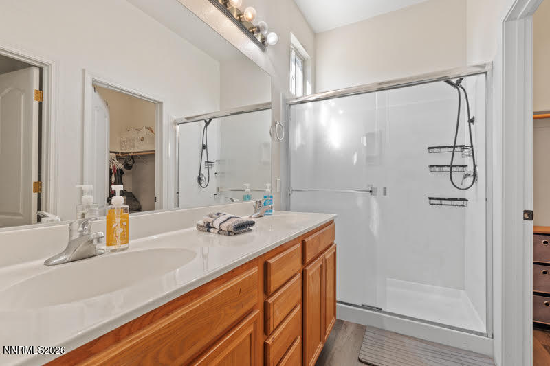 10025 Hampton Park Drive Reno, NV 89521 - Photo 10 of 16 a bathroom with a granite countertop sink mirror and shower