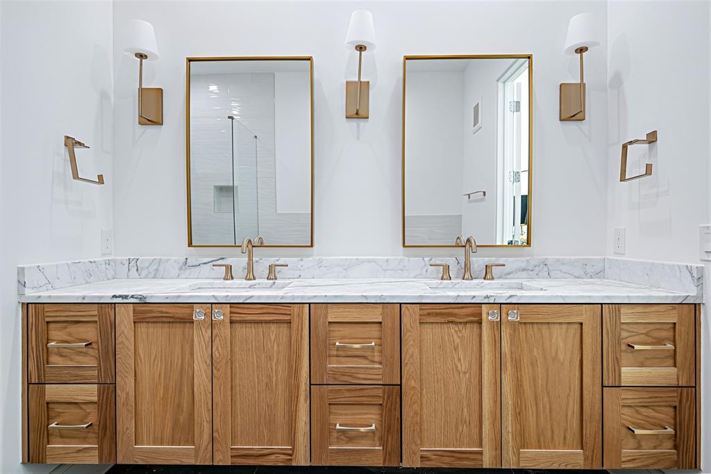 350 O O Connor Ridge Boulevard, Unit 13 Irving, TX 75038 - Photo 22 of 36 A spa-inspired primary bath featuring dual vanities, a soaking tub and a walk-in shower, combining luxury and tranquility!(Photo of model showroom)