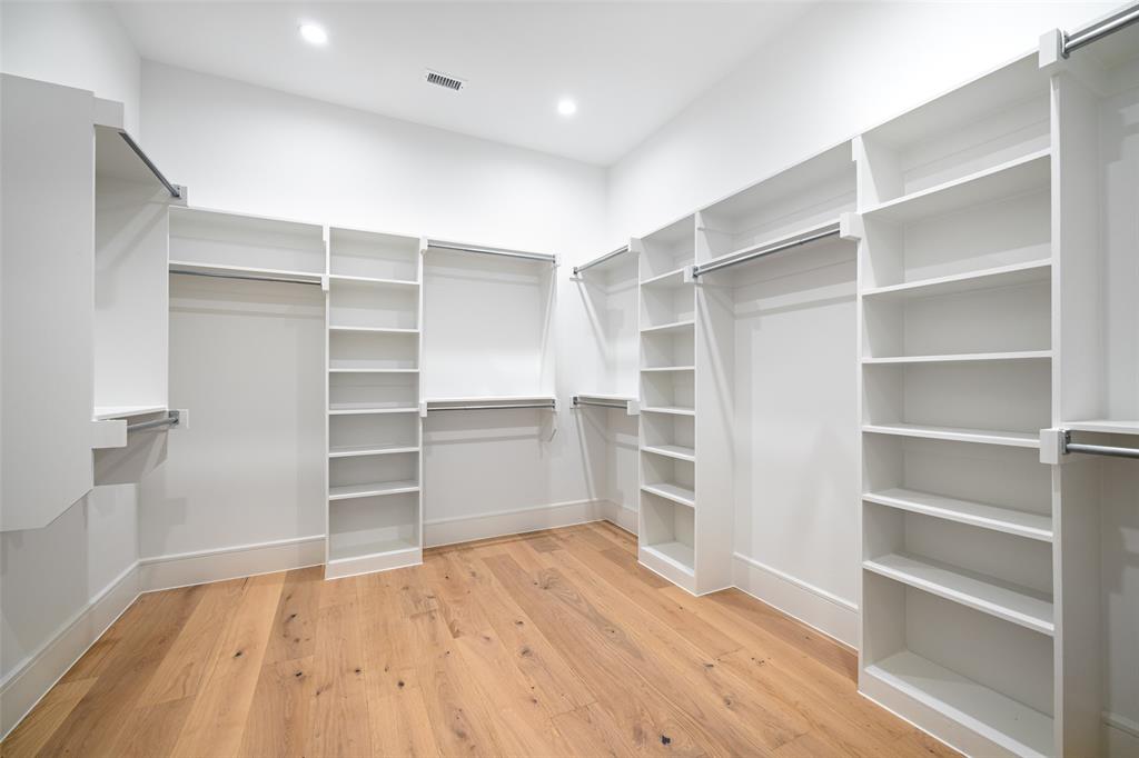 350 O O Connor Ridge Boulevard, Unit 13 Irving, TX 75038 - Photo 23 of 36 Spacious closets throughout-this is the primary closet of the model showroom