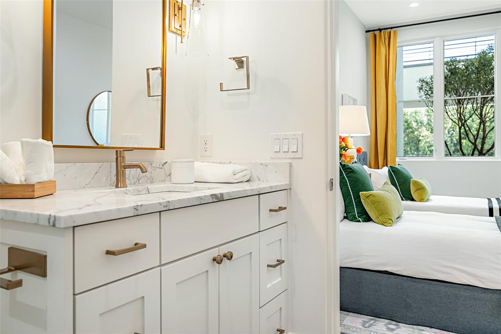 350 O O Connor Ridge Boulevard, Unit 13 Irving, TX 75038 - Photo 25 of 36 Ensuite bath offering privacy and comfort for family or guests(Photo of model showroom)