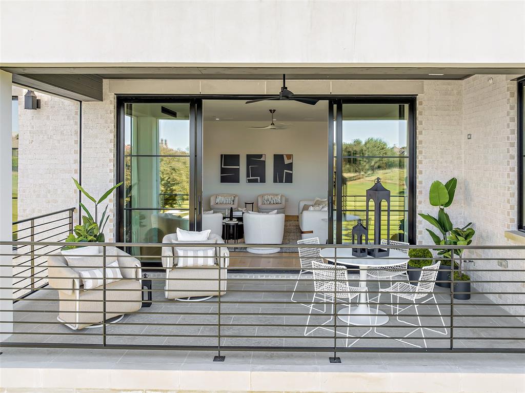 350 O O Connor Ridge Boulevard, Unit 13 Irving, TX 75038 - Photo 10 of 36 Seamless indoor-outdoor living with a patio that frames breathtaking fairway views!(Photo of model showroom)