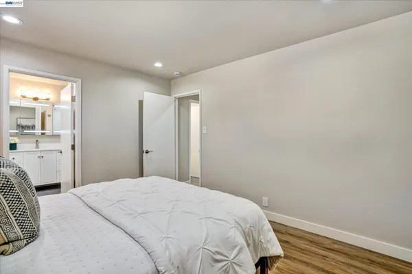 a bathroom with a sink toilet and mirror