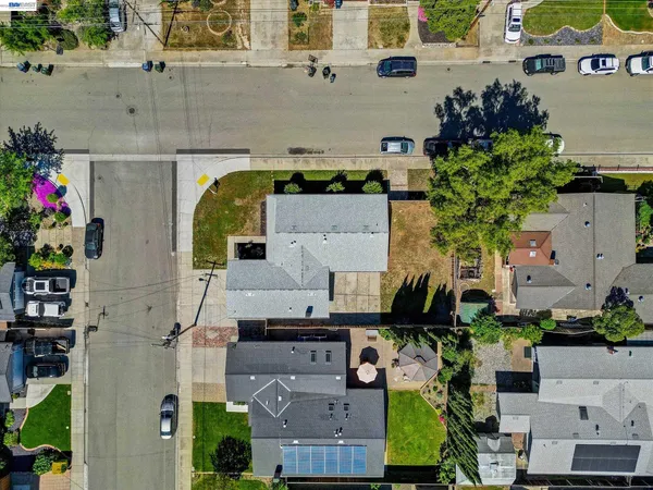 an aerial view of houses with outdoor space
