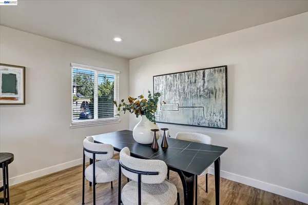 a kitchen with stainless steel appliances a refrigerator and a stove top oven