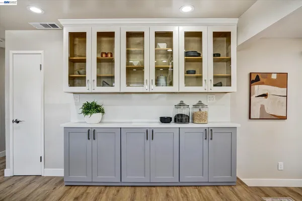 a kitchen with cabinets a sink and appliances