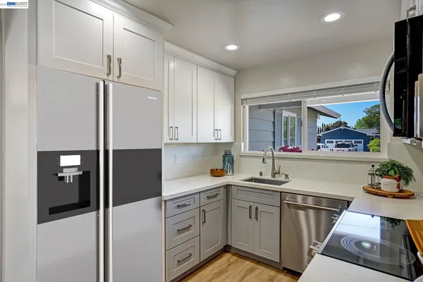 a kitchen with a sink and cabinets